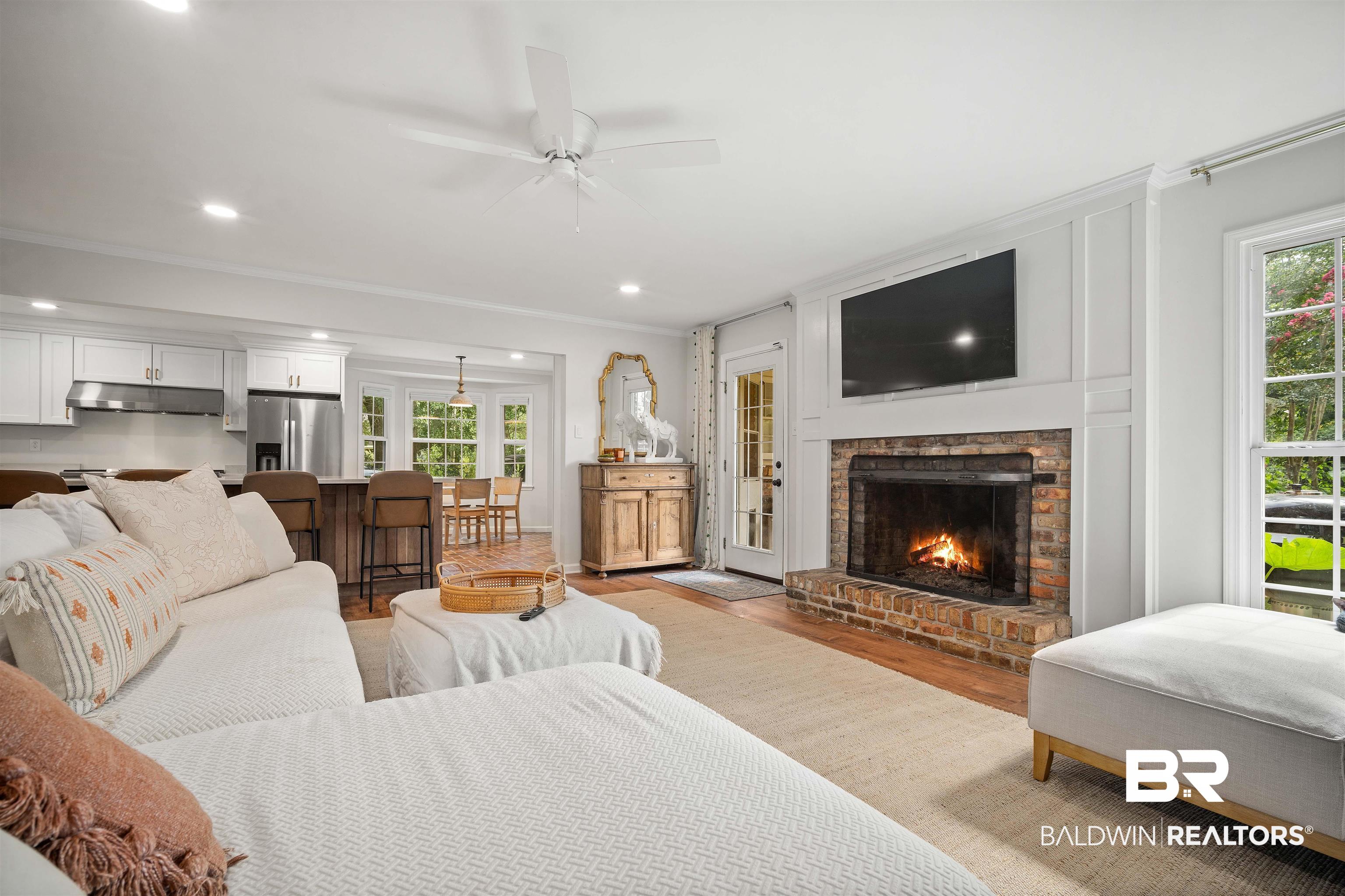 700 Eliza Jordan Road North Mobile, AL 36608 - Photo 18 of 44 Living room with light wood-type flooring, ornamental molding, a fireplace, ceiling fan, and recessed lighting