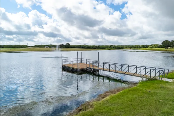 a view of a lake with outdoor seating