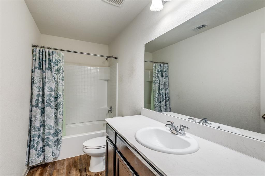 5525 McMahan Lane Fort Worth, TX 76036 - Photo 14 of 21 a bathroom with a sink toilet and shower