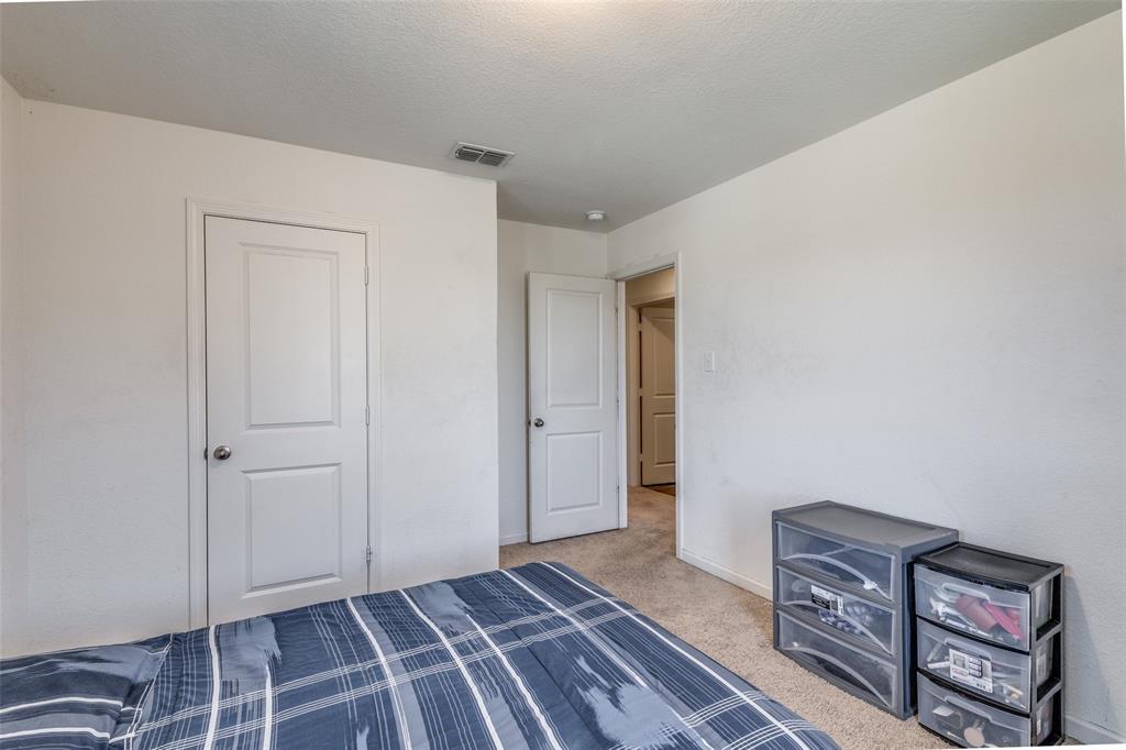 5525 McMahan Lane Fort Worth, TX 76036 - Photo 16 of 21 a view of an empty room and wooden floor