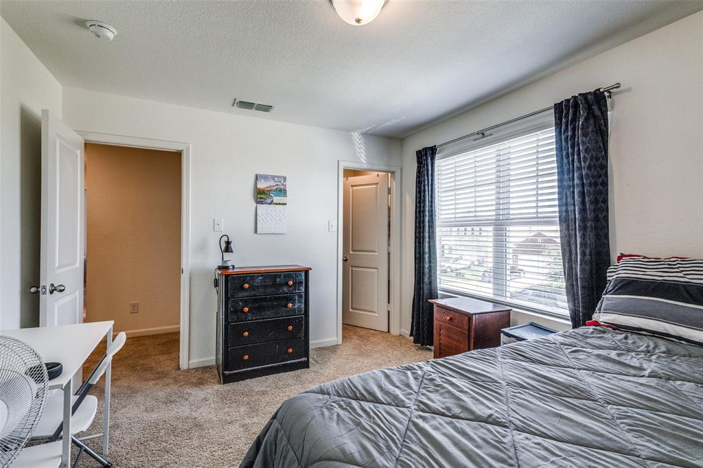 5525 McMahan Lane Fort Worth, TX 76036 - Photo 19 of 21 a bedroom with a bed and a window