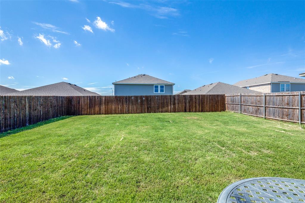 5525 McMahan Lane Fort Worth, TX 76036 - Photo 20 of 21 a view of a backyard with table and chairs