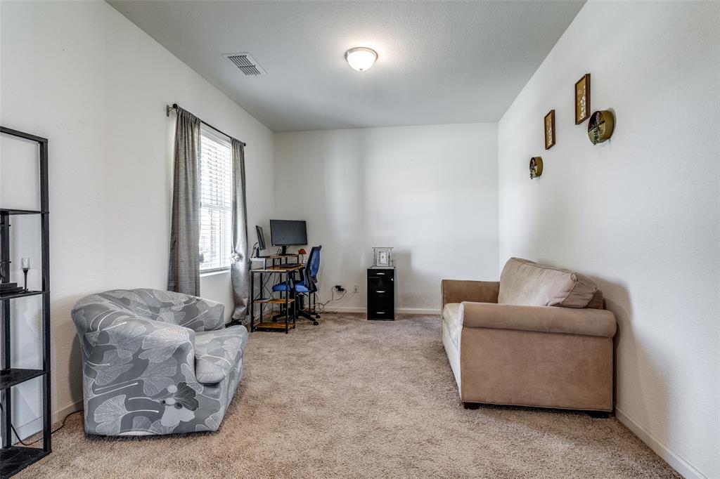 5525 McMahan Lane Fort Worth, TX 76036 - Photo 7 of 21 a living room with furniture and a window