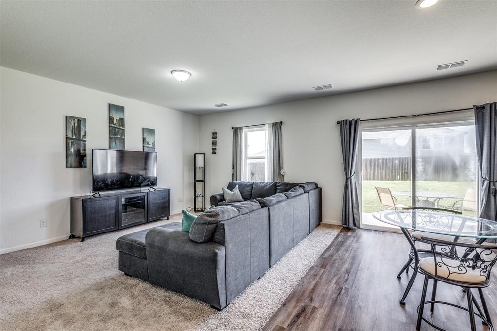 5525 McMahan Lane Fort Worth, TX 76036 - Photo 8 of 21 a living room with furniture and a flat screen tv