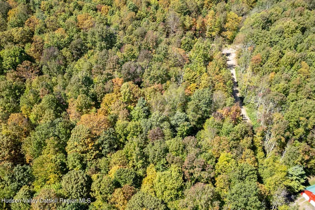 an aerial view of residential house and outdoor space