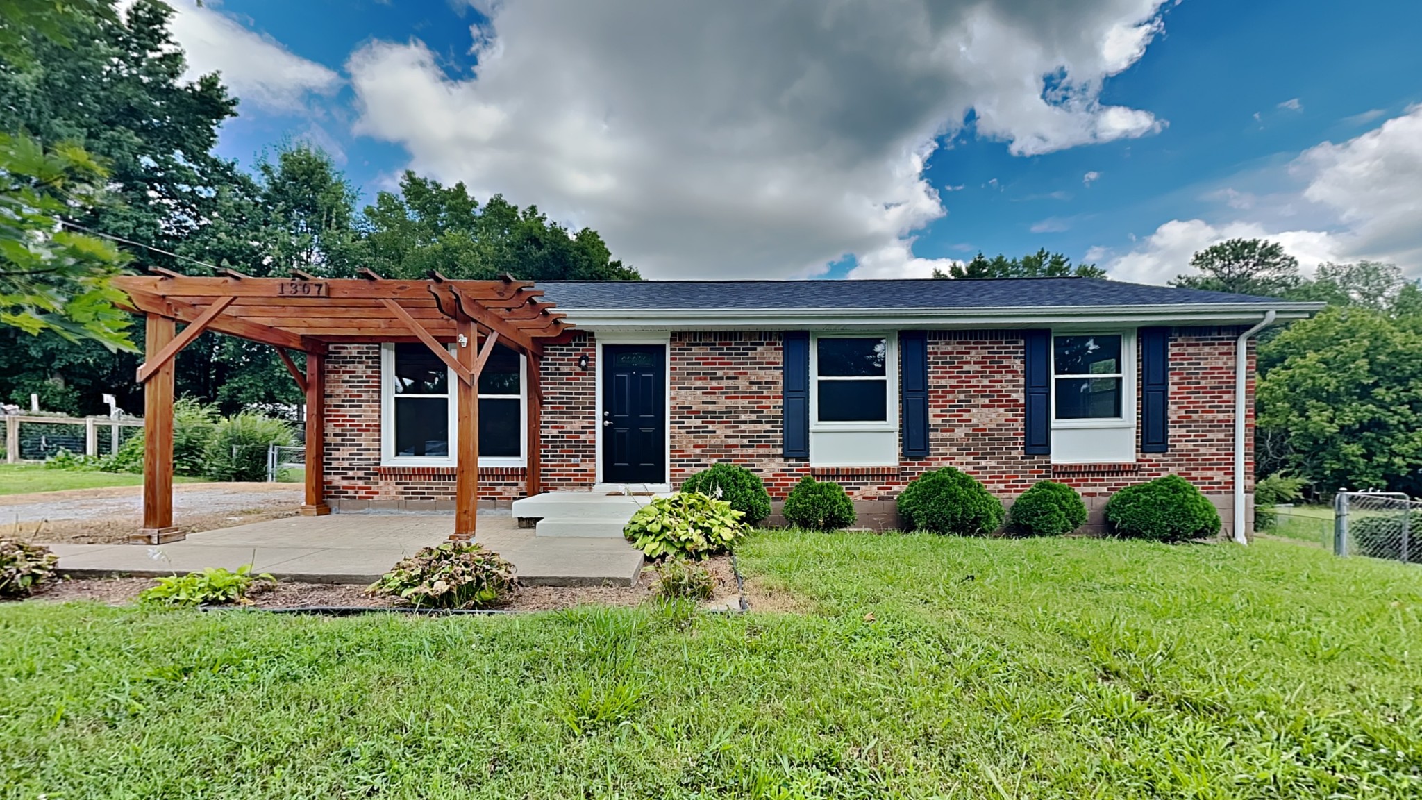 front view of a house with a yard
