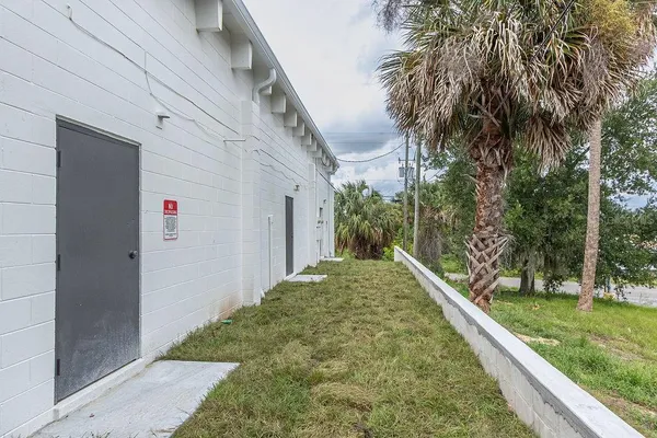 a view of a house with a small yard