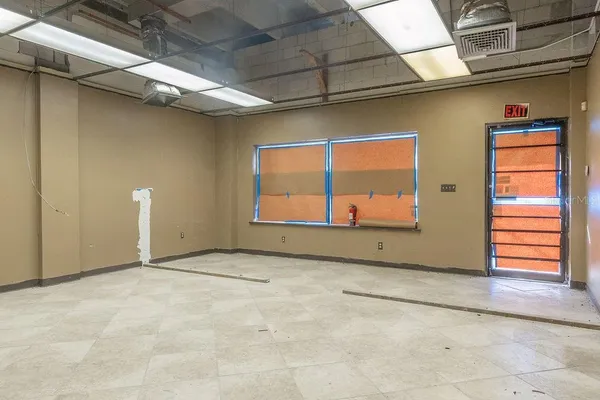 a view of a room with a large window