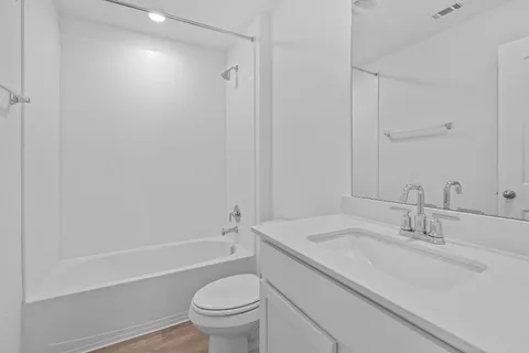 a bathroom with a sink and mirror