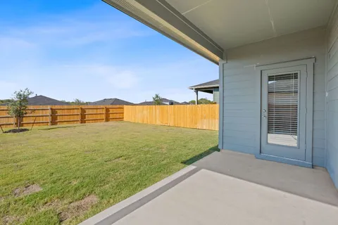 a house view with swimming pool in front of it