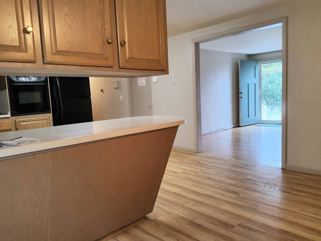 46 Lake Parkway Webster, MA 01570 - Photo 16 of 42 a view of a kitchen cabinets and wooden floor