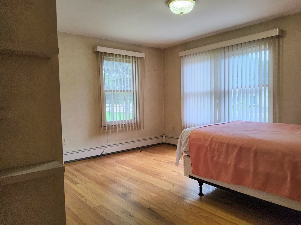 46 Lake Parkway Webster, MA 01570 - Photo 24 of 42 a bed sitting in a spacious bedroom next to a window
