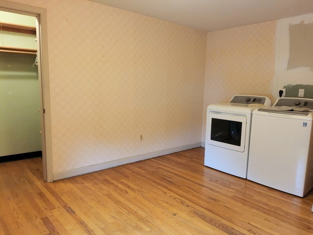 46 Lake Parkway Webster, MA 01570 - Photo 27 of 42 a view of storage and utility room with wooden floor
