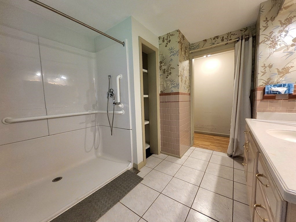 46 Lake Parkway Webster, MA 01570 - Photo 29 of 42 a bathroom with a bathtub and a shower