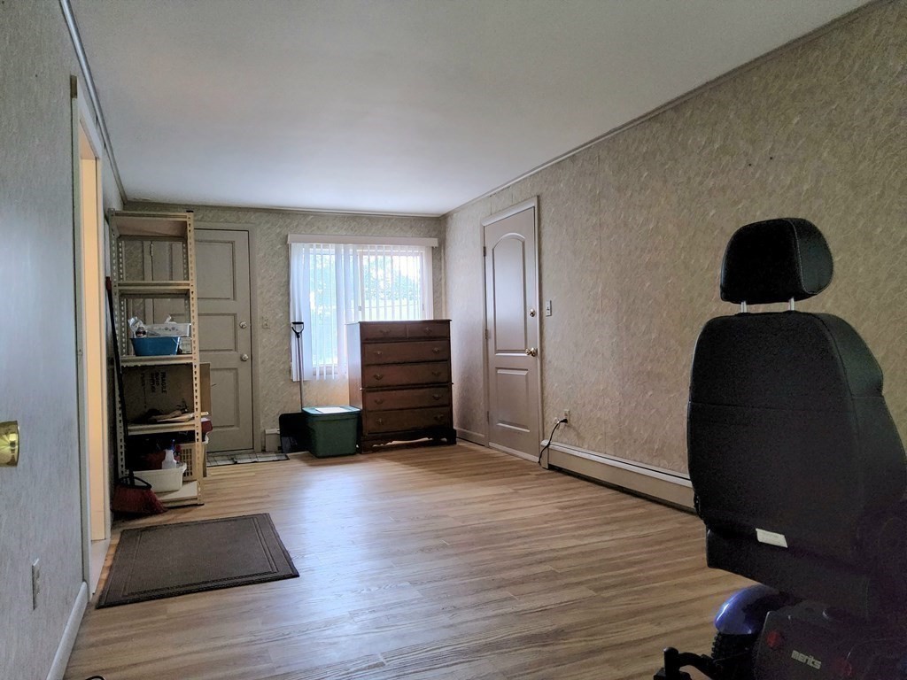 46 Lake Parkway Webster, MA 01570 - Photo 30 of 42 a view of a livingroom with wooden floor and furniture