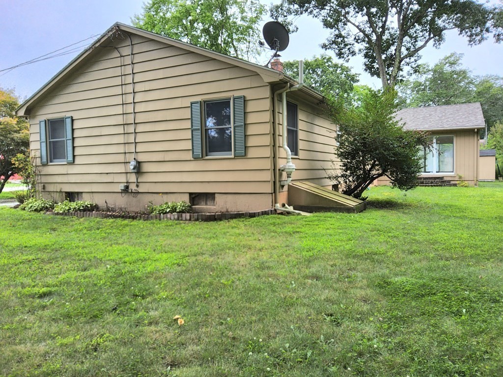 46 Lake Parkway Webster, MA 01570 - Photo 4 of 42 a view of a house with a yard and a garden