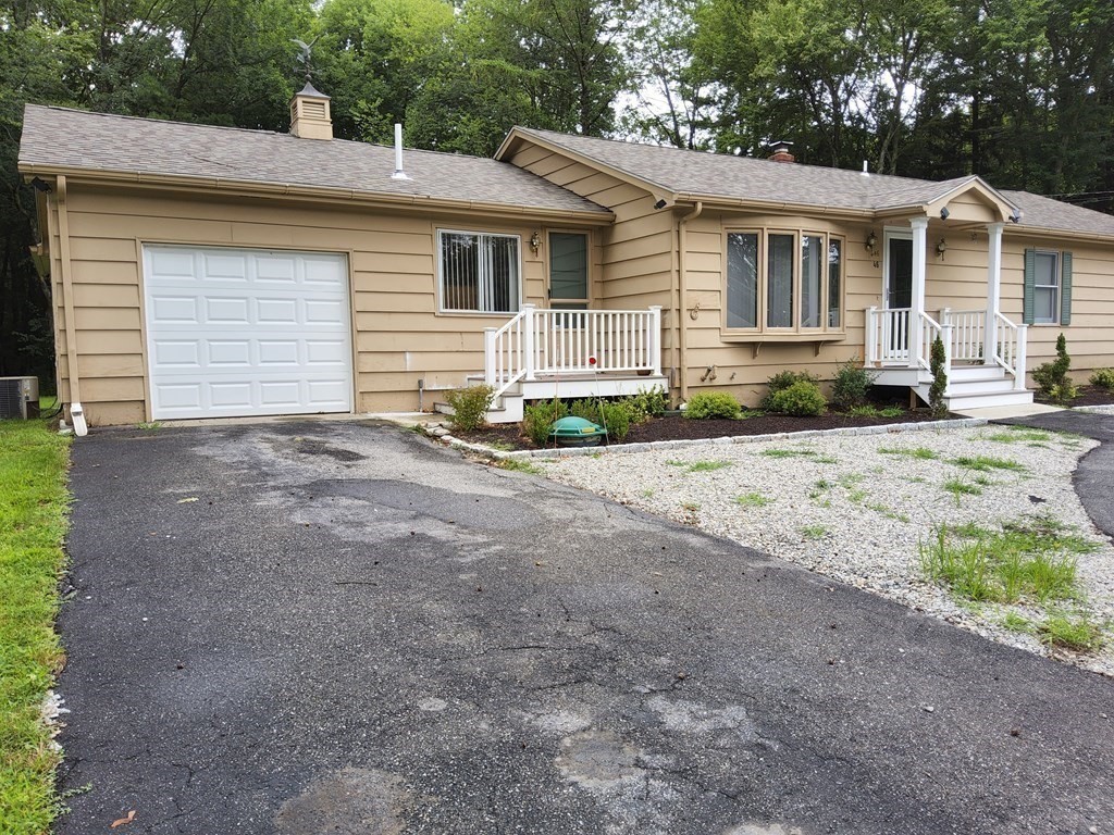 46 Lake Parkway Webster, MA 01570 - Photo 10 of 42 a view of a house with a yard and large tree