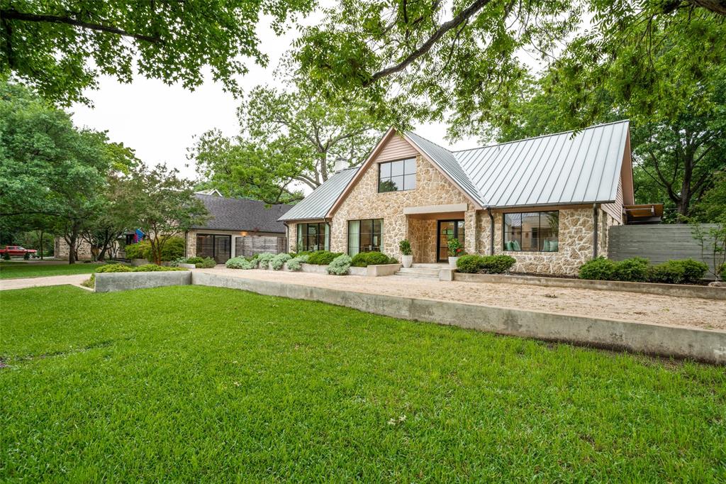 4325 Pomona Road Dallas, TX 75209 - Photo 2 of 23 Stone exterior featuring a metal roof, prominent gables, and large windows