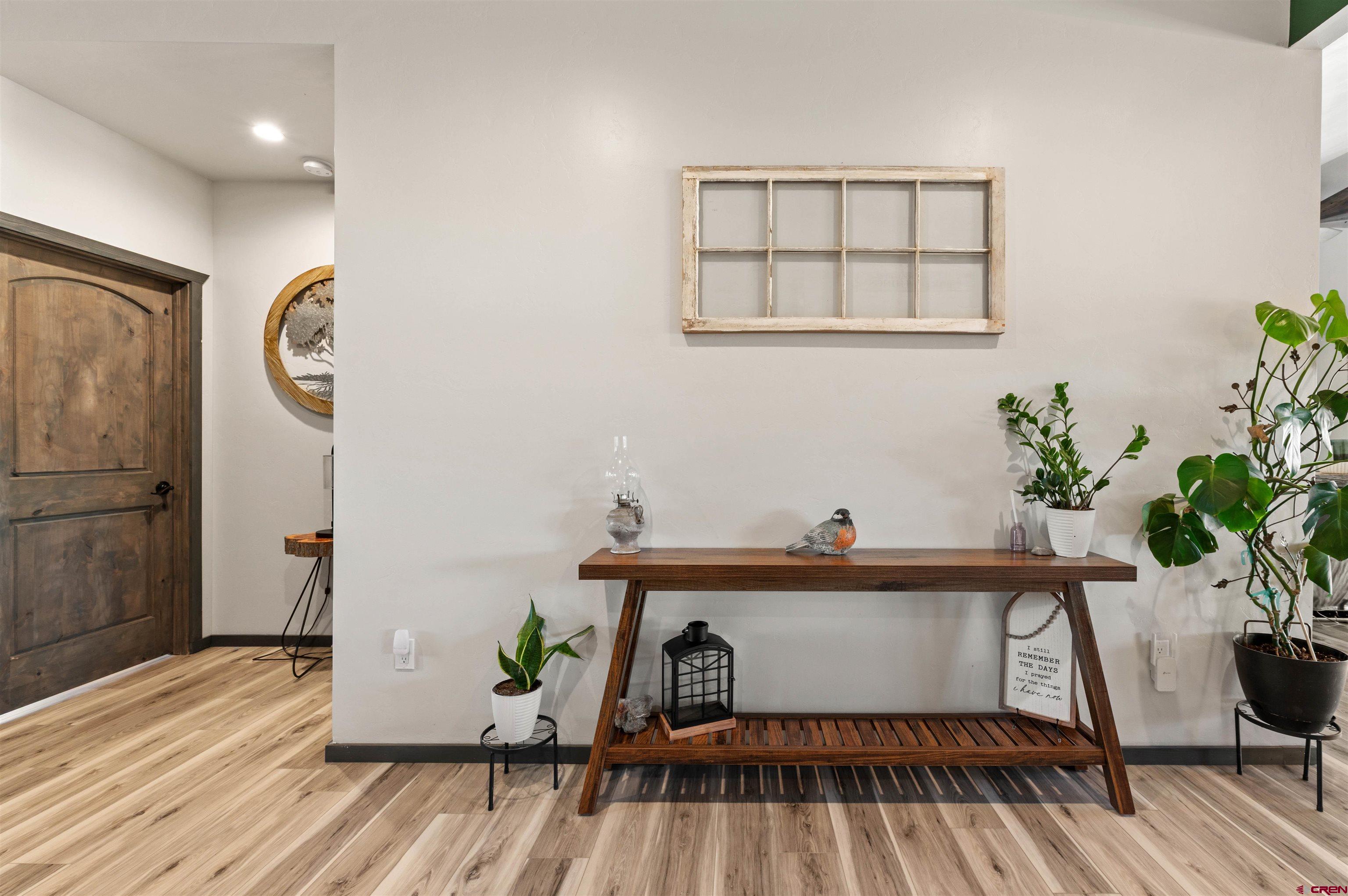 55347 Begonia Road Delta, CO 81416 - Photo 21 of 44 a bedroom with a bed and a potted plant on table