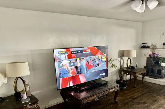 a living room with furniture and a lamp