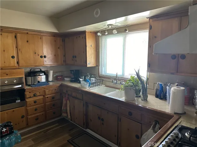 a kitchen with a sink and cabinets