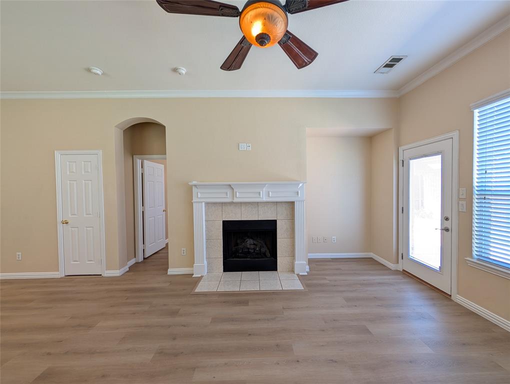 6620 Crator Drive McKinney, TX 75070 - Photo 13 of 26 a view of a livingroom with a fireplace and window