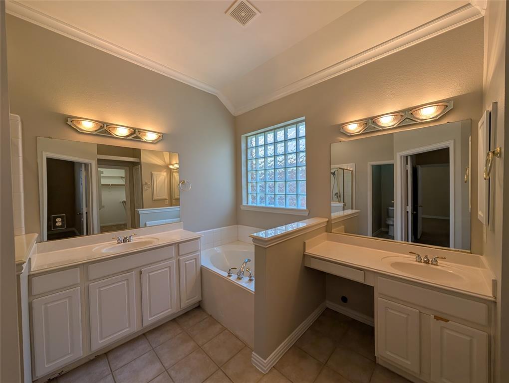 6620 Crator Drive McKinney, TX 75070 - Photo 18 of 26 a bathroom with a sink double vanity granite tub and a mirror