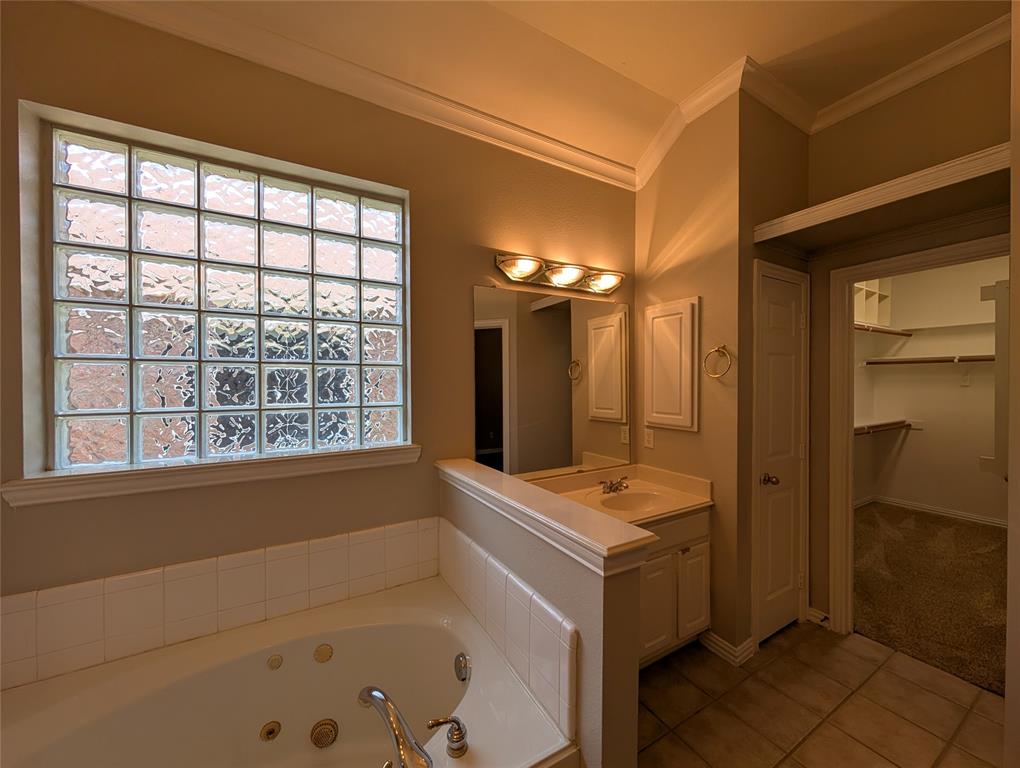 6620 Crator Drive McKinney, TX 75070 - Photo 19 of 26 a bathroom with a tub sink and mirror