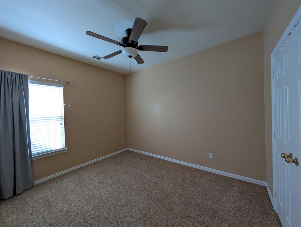 6620 Crator Drive McKinney, TX 75070 - Photo 21 of 26 an empty room with a window and a fan