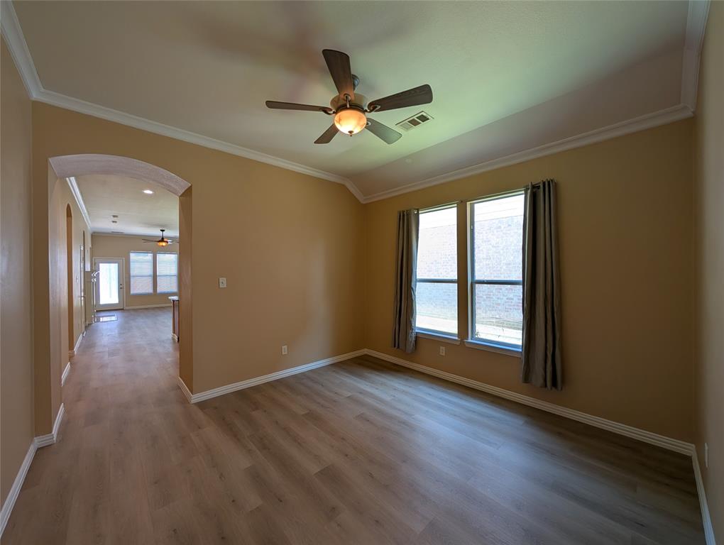 6620 Crator Drive McKinney, TX 75070 - Photo 6 of 26 a view of empty room with wooden floor and fan