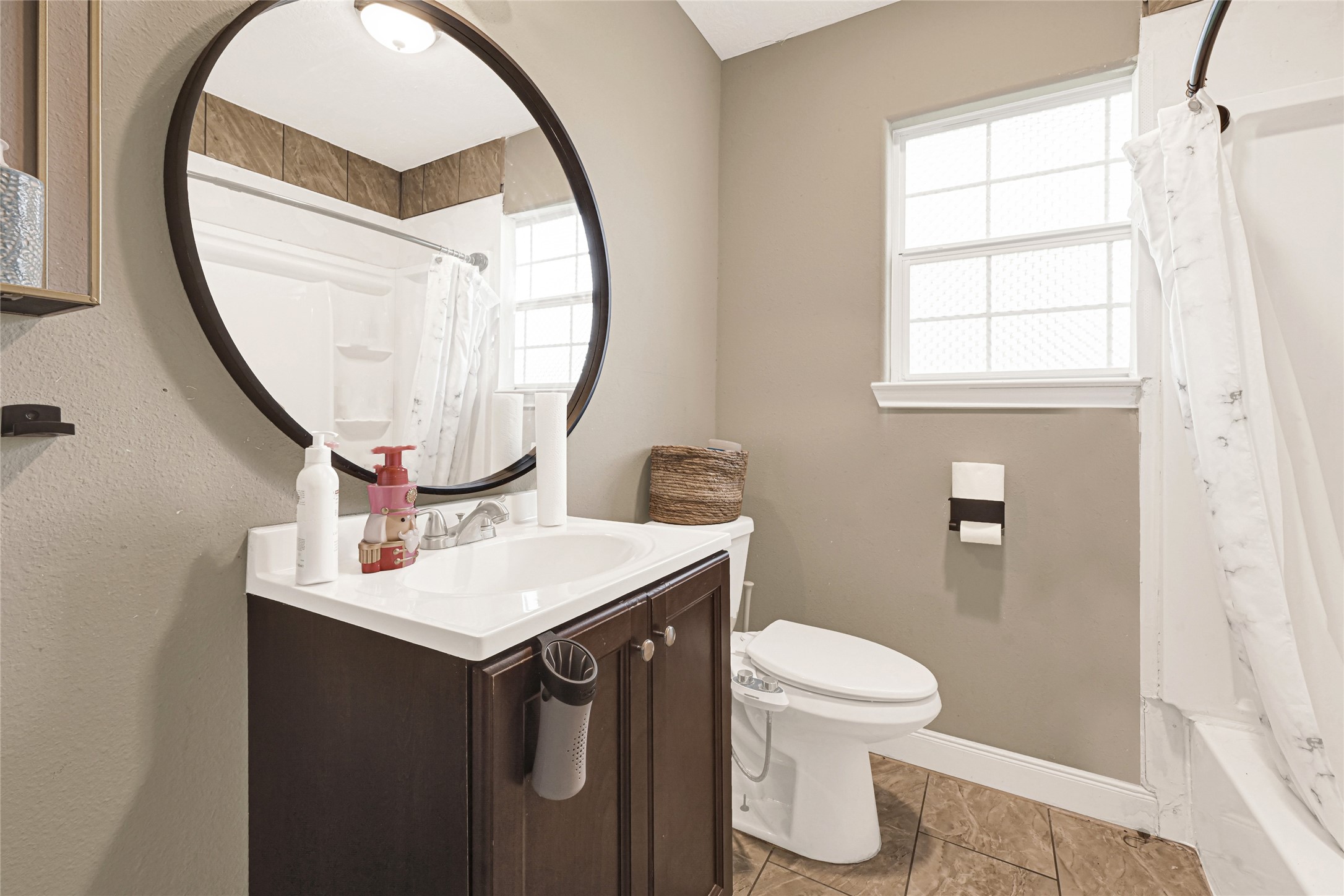 4529 Perry Street Houston, TX 77021 - Photo 13 of 20 a bathroom with a sink a toilet and a mirror