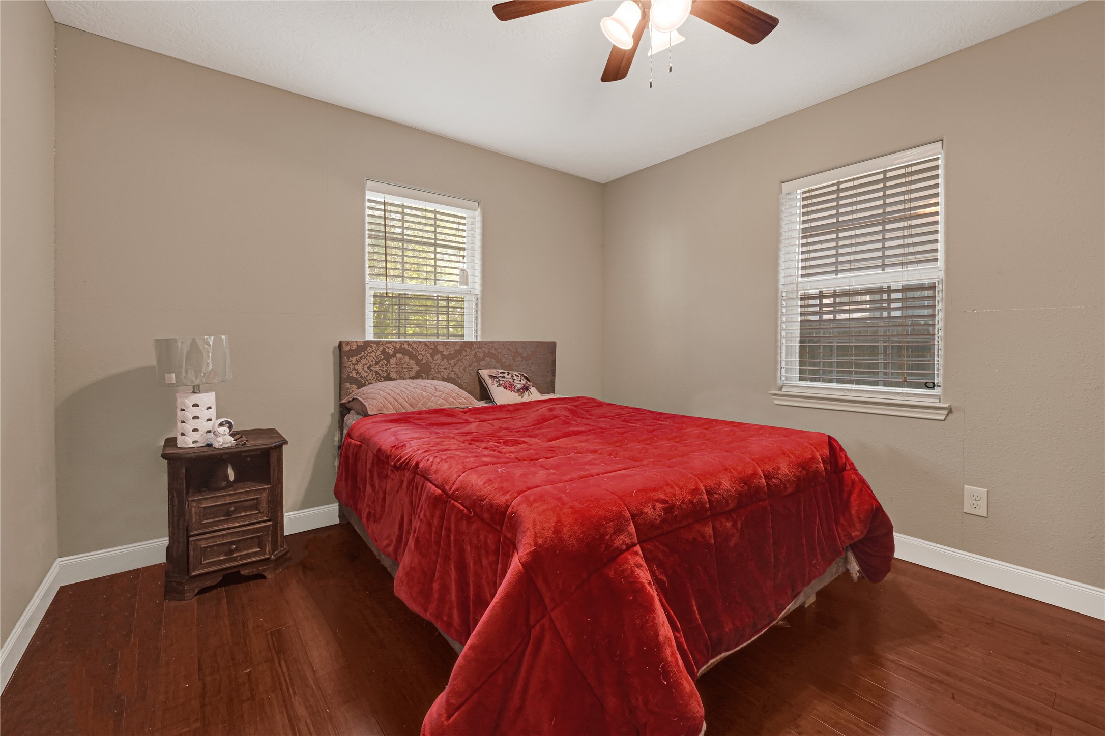 4529 Perry Street Houston, TX 77021 - Photo 14 of 20 a bed sitting in a bedroom next to a window and a chandelier