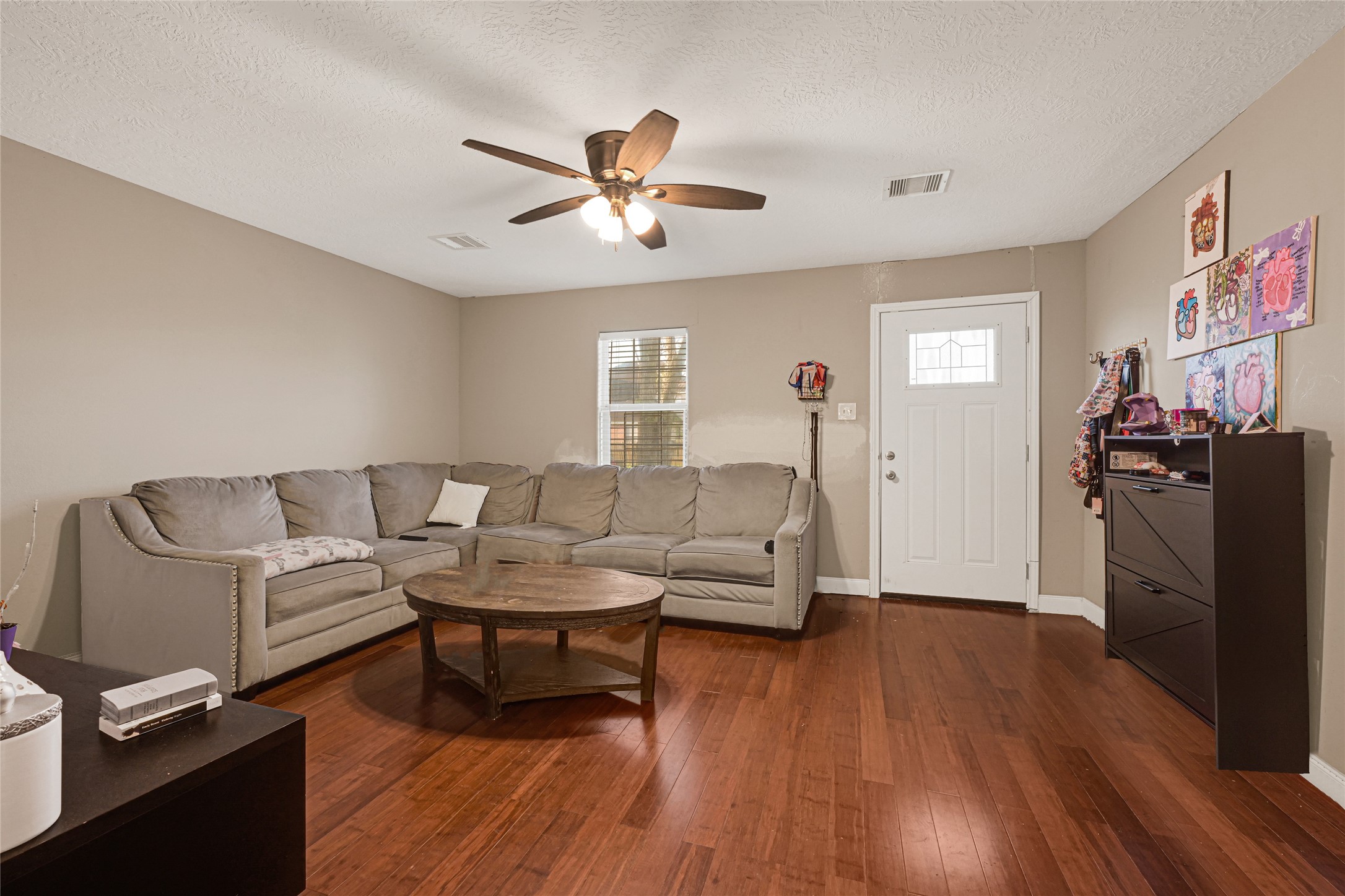 4529 Perry Street Houston, TX 77021 - Photo 4 of 20 a living room with furniture and a wooden floor
