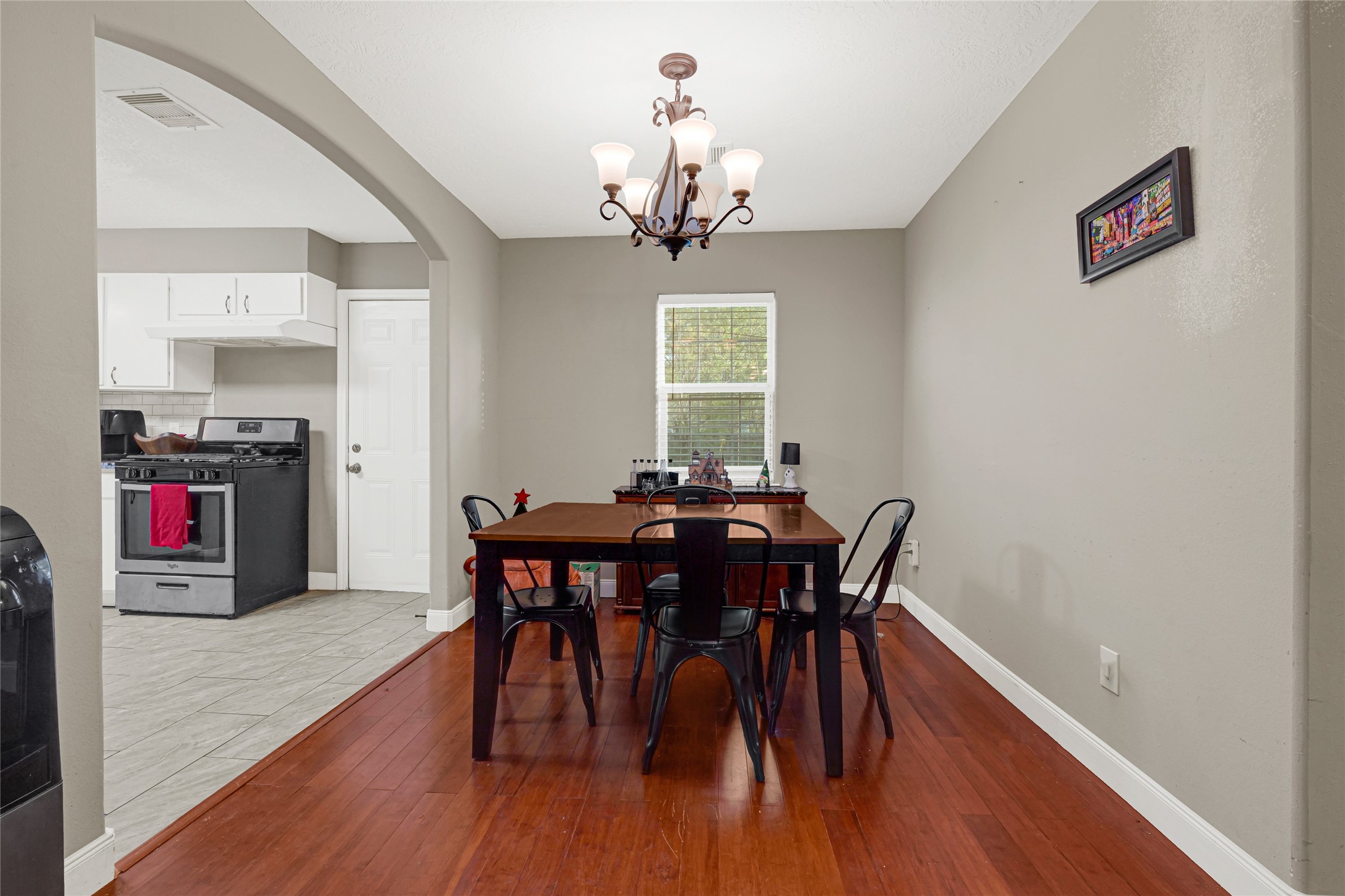 4529 Perry Street Houston, TX 77021 - Photo 9 of 20 a view of a dining room with furniture wooden floor and chandelier