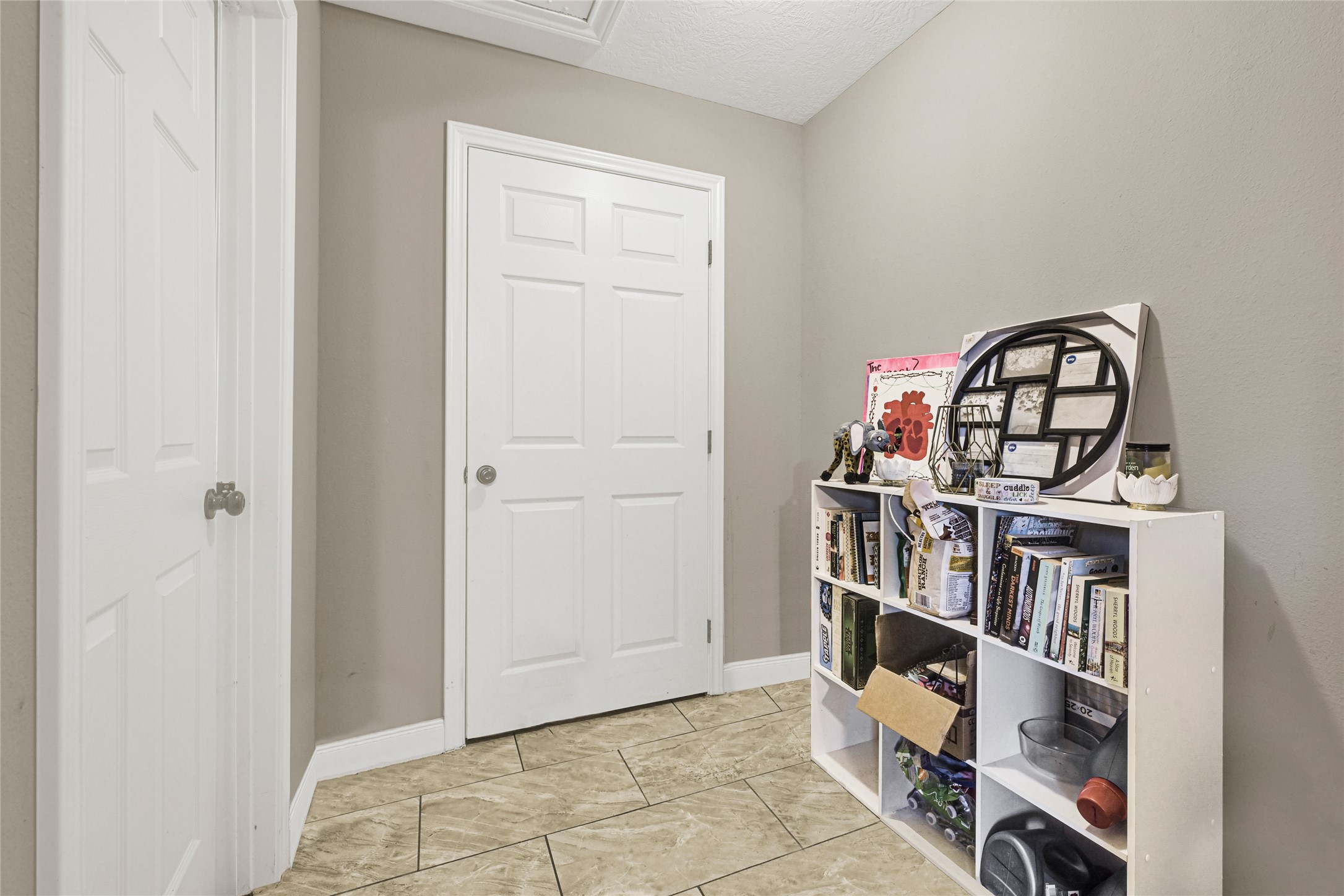 4529 Perry Street Houston, TX 77021 - Photo 10 of 20 a view of a book shelf with a room in the background