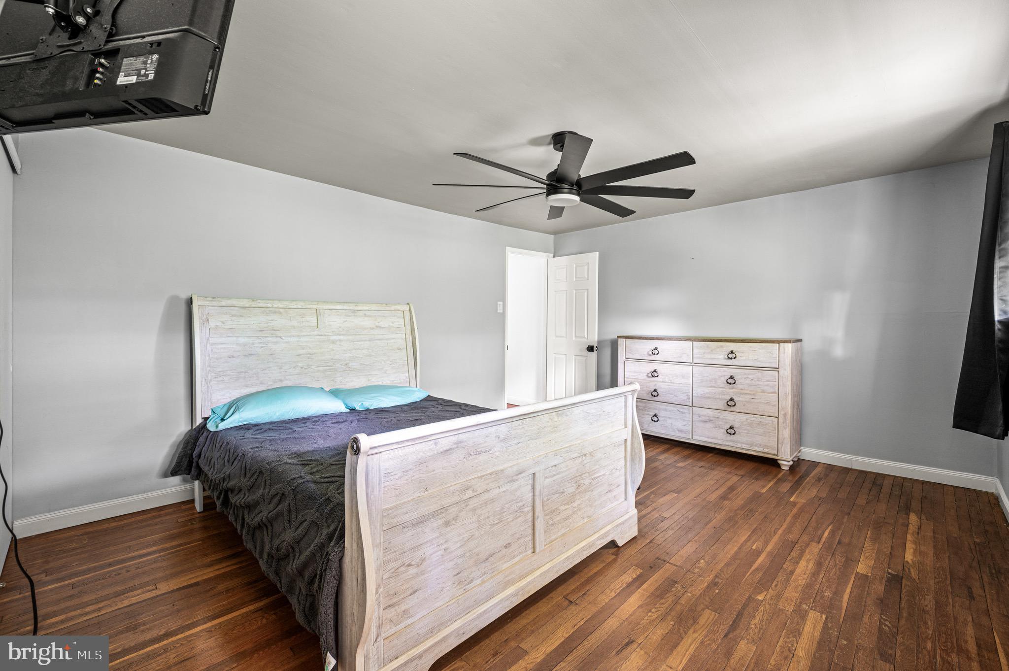 3583 Nottingham Lane Philadelphia, PA 19114 - Photo 12 of 23 a living room with a bed and a tv