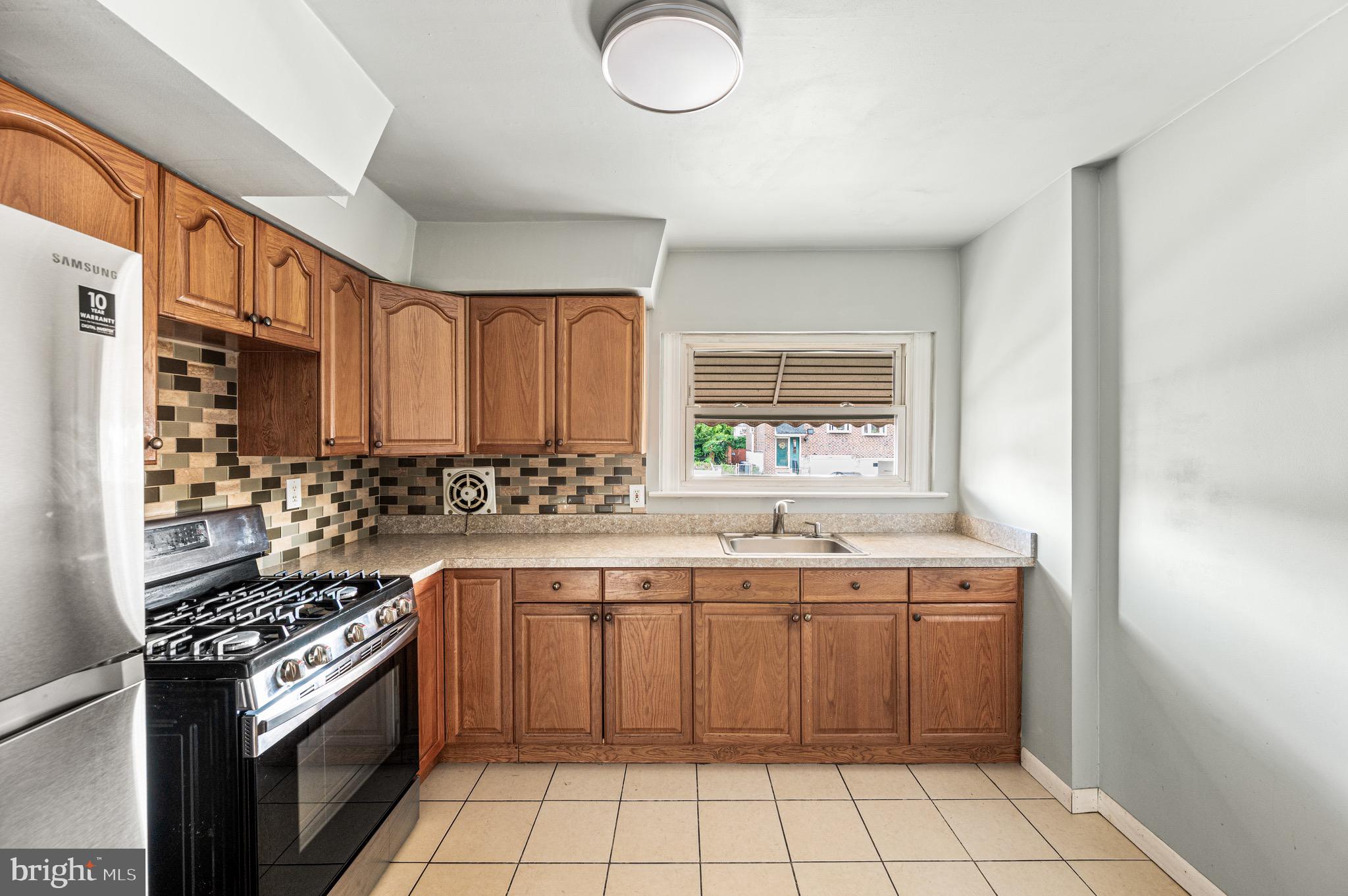 3583 Nottingham Lane Philadelphia, PA 19114 - Photo 5 of 23 a kitchen with a sink stove and cabinets