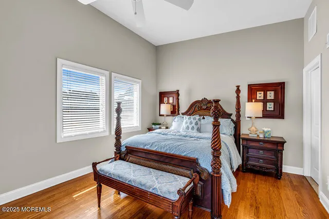 a bedroom with a bed and a dresser next to it