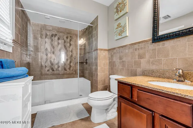 a bathroom with a sink a toilet and a bathtub