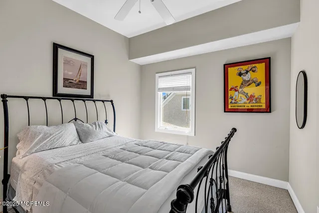 a bedroom with a bed and a table in it