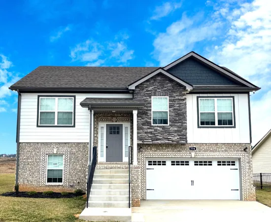 a front view of a house with yard