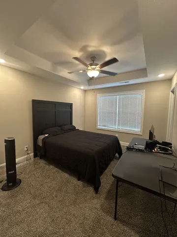 a bedroom with a bed and window