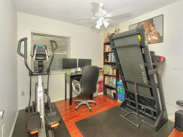 a view of a workspace with furniture