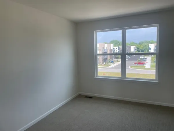 an empty room that has a window