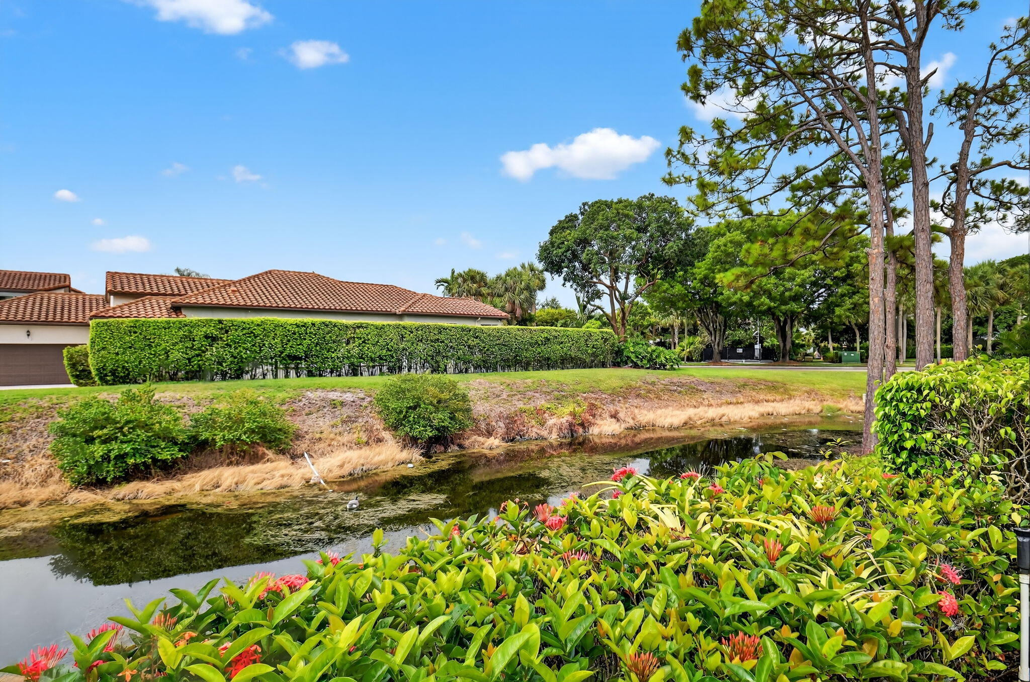 6390 Via Rosa Boca Raton, FL 33433 - Photo 36 of 45 a view of a garden with a lake