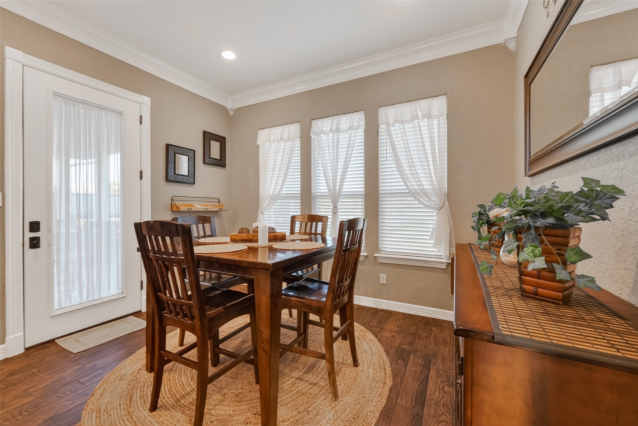 912 County Road 340 Angleton, TX 77515 - Photo 18 of 50 This cozy dining area features natural light from three windows with sheer curtains. The space is accented by warm, neutral walls creating an inviting atmosphere.