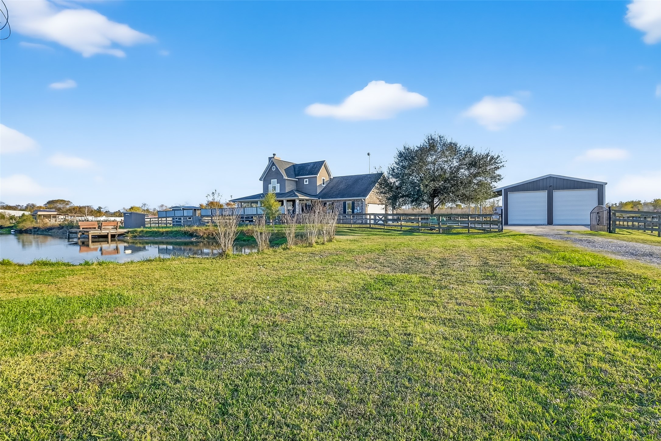 912 County Road 340 Angleton, TX 77515 - Photo 3 of 50 Charming country home with a spacious yard, pond, and dock. Features a detached garage and scenic views, perfect for tranquil living.