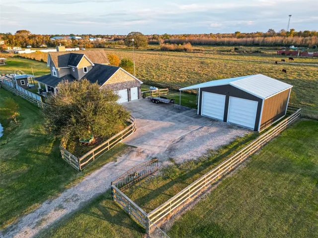 an aerial view of a house with outdoor space