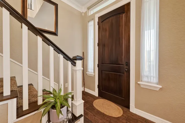 a view of staircase with wooden floor and potted plant