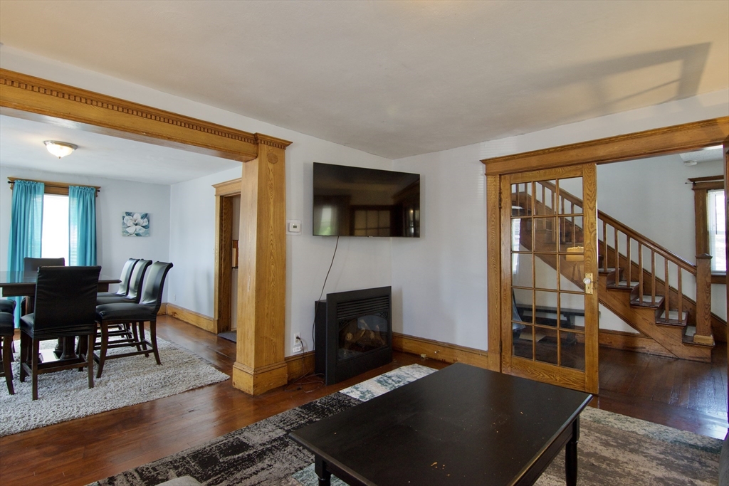 16 Amity Court Springfield, MA 01108 - Photo 10 of 42 a living room with furniture wooden floor and a flat screen tv